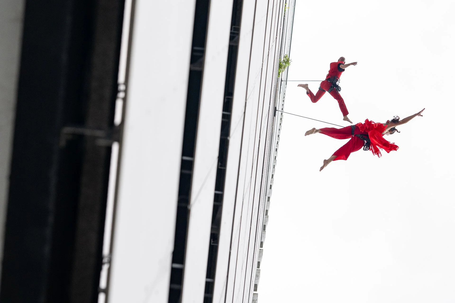  Acrobats launch themselves from the facade of the 35-storey Brusilia tower in Schaerbeek, September 2024 