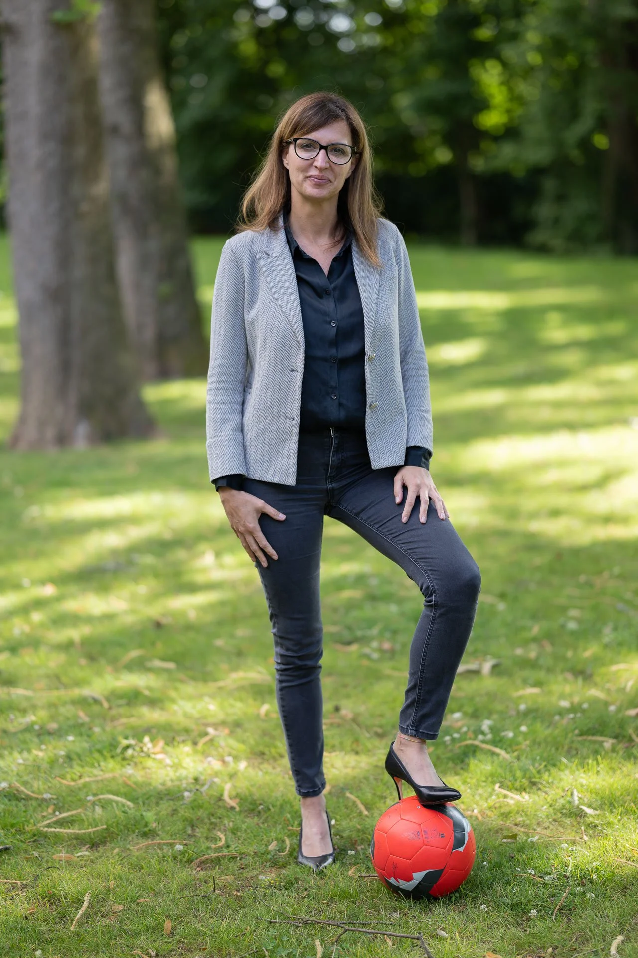  I photographed this businesswoman at her home. I suggested shooting with her son’s football, and she liked the idea. 