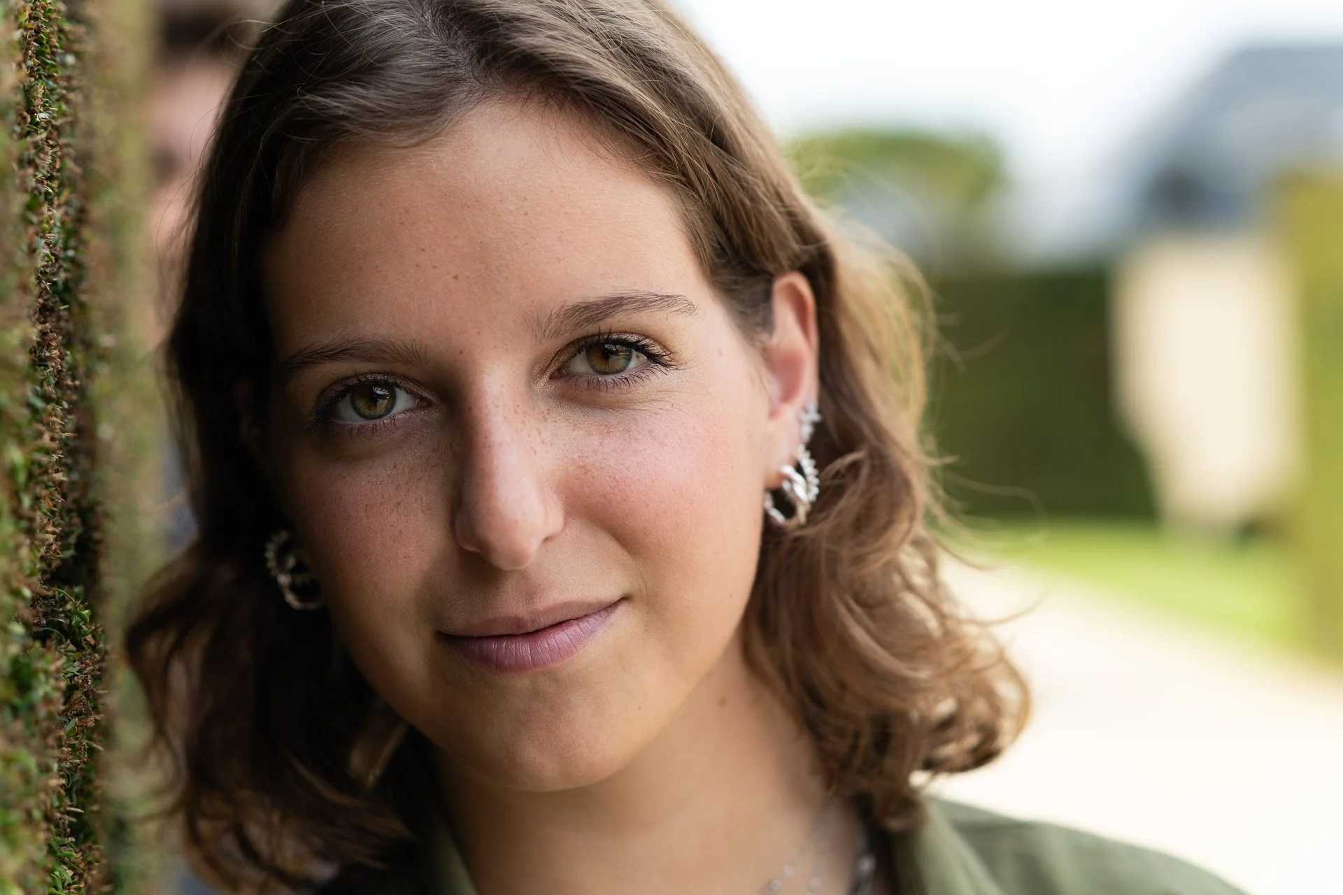  Close-up portrait of a young woman in a park 