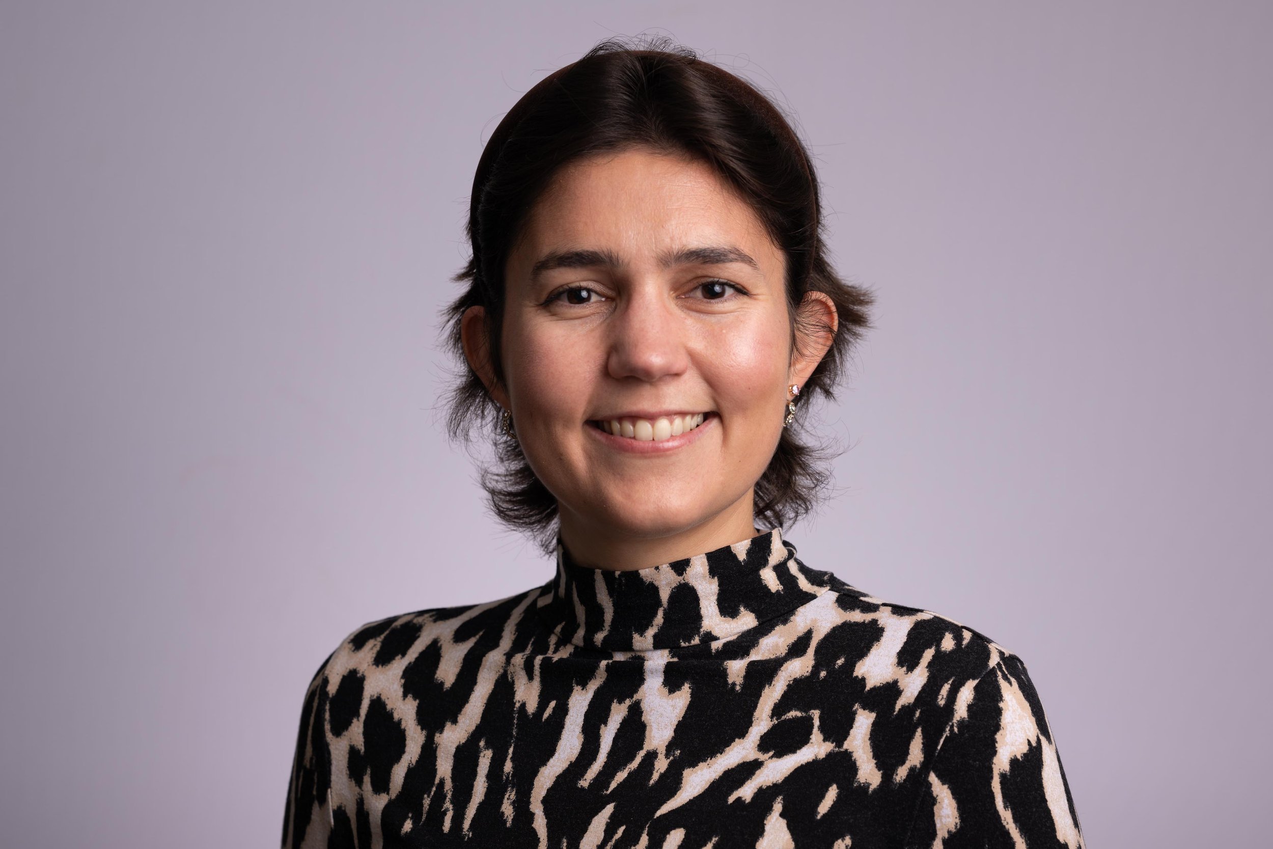 Headshot of a young woman made on-site in a pop-up studio