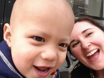 Mac w/ Elizabeth cheering her mom on at the marathon