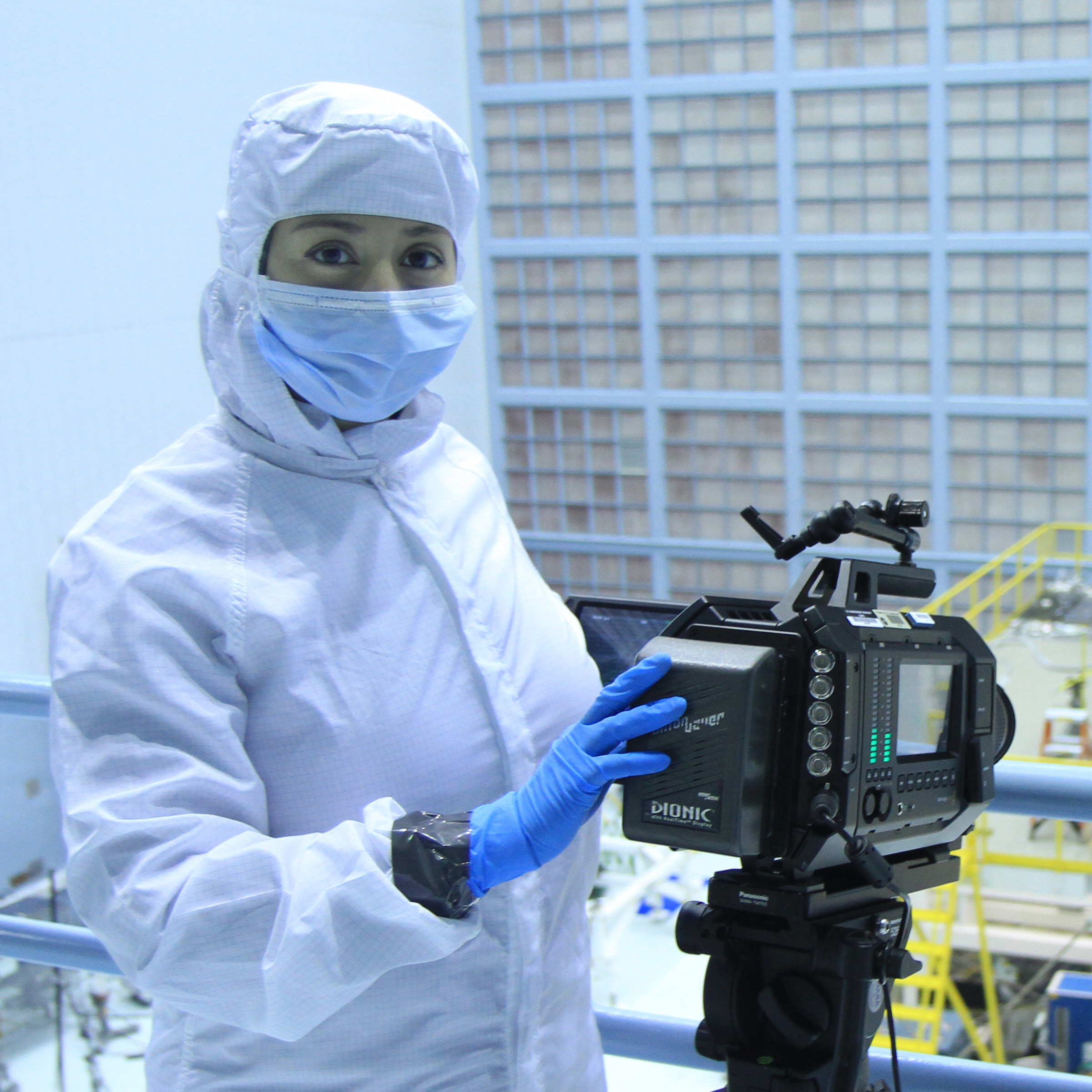 NASA Cinematographer Nasreen Alkhateeb filming in the NASA Clean Room with a Black Magic 4K camera