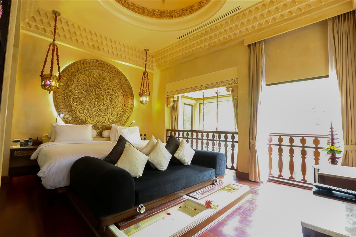King bed bedroom with double foot bath with sofa