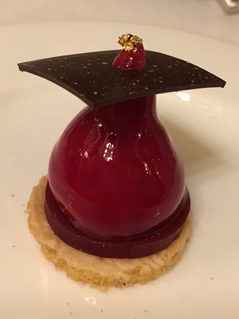 Plum flavoured treat with gold leaf sprinkle