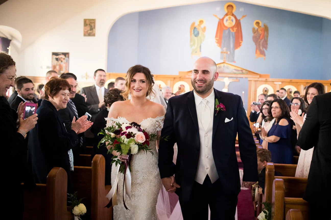 Bride and Groom coming down the aisle