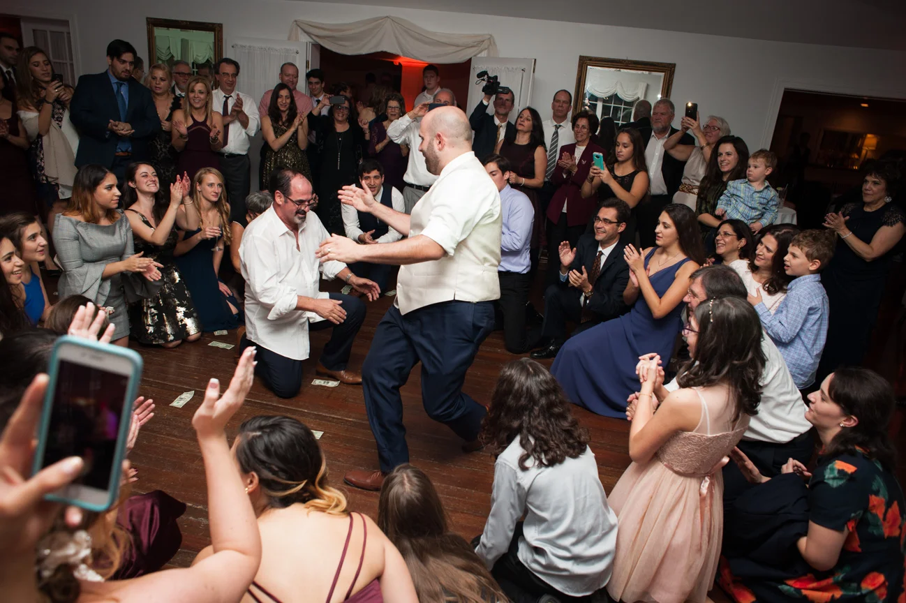 Groom dancing with father