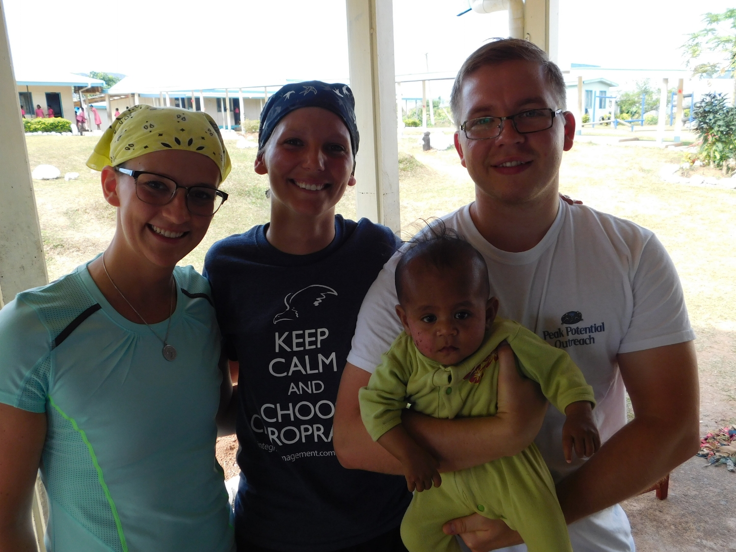 Drs. Hannah & Alex with colleague and child