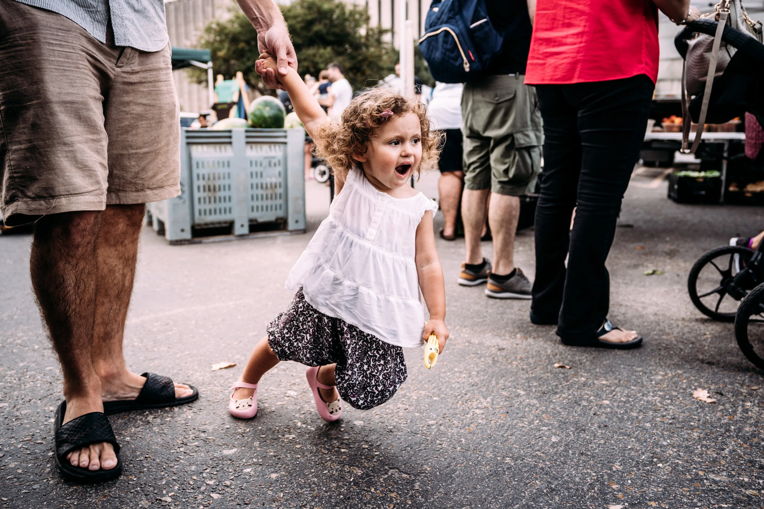 Little girl drags daddy along