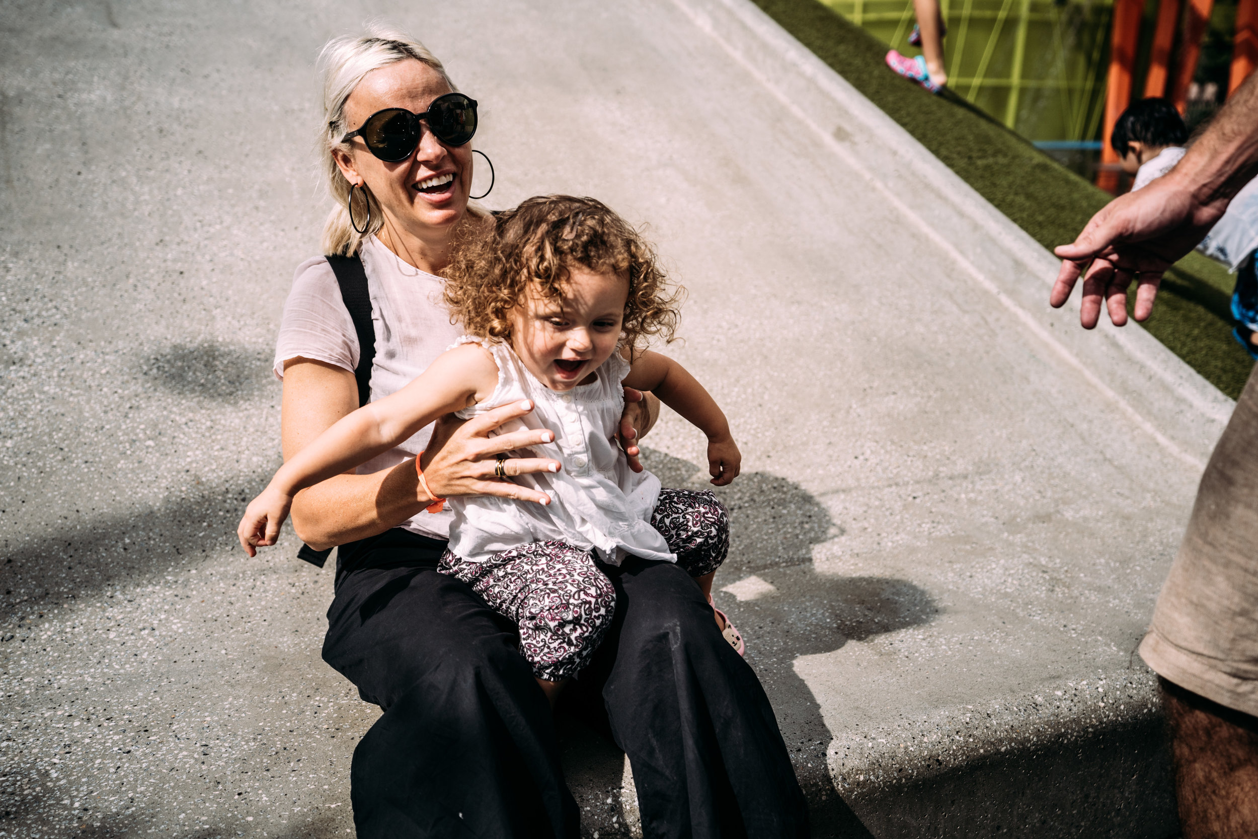 Mom and daughter laugh together