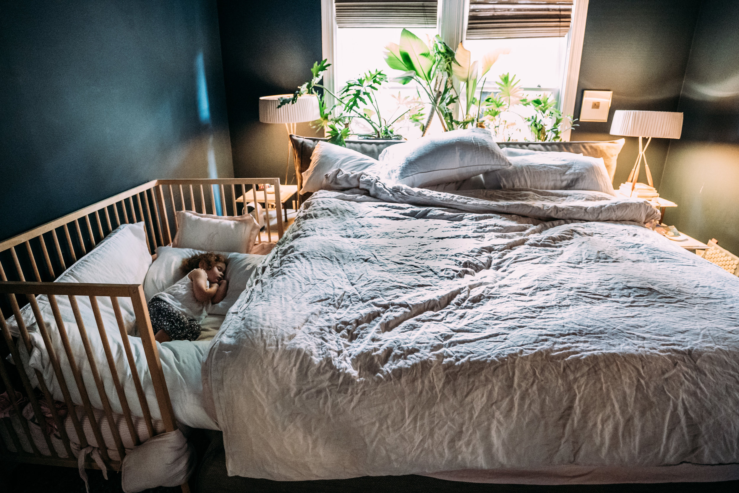 Little girl in her Co-sleeper