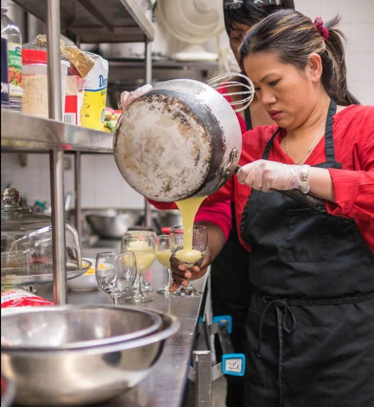 A survivor takes part in Mentari’s culinary program
