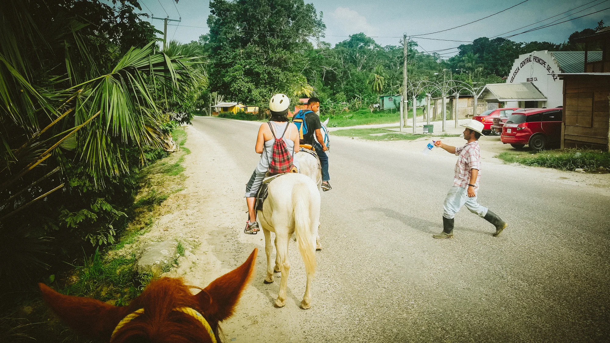 In the small village of San Jose Succotz, our guide from Hanna Stables got a quick refreshment from a friend after crossing the Mopan River on pulley ferry. My horse, Justice, did it like the pro he is!