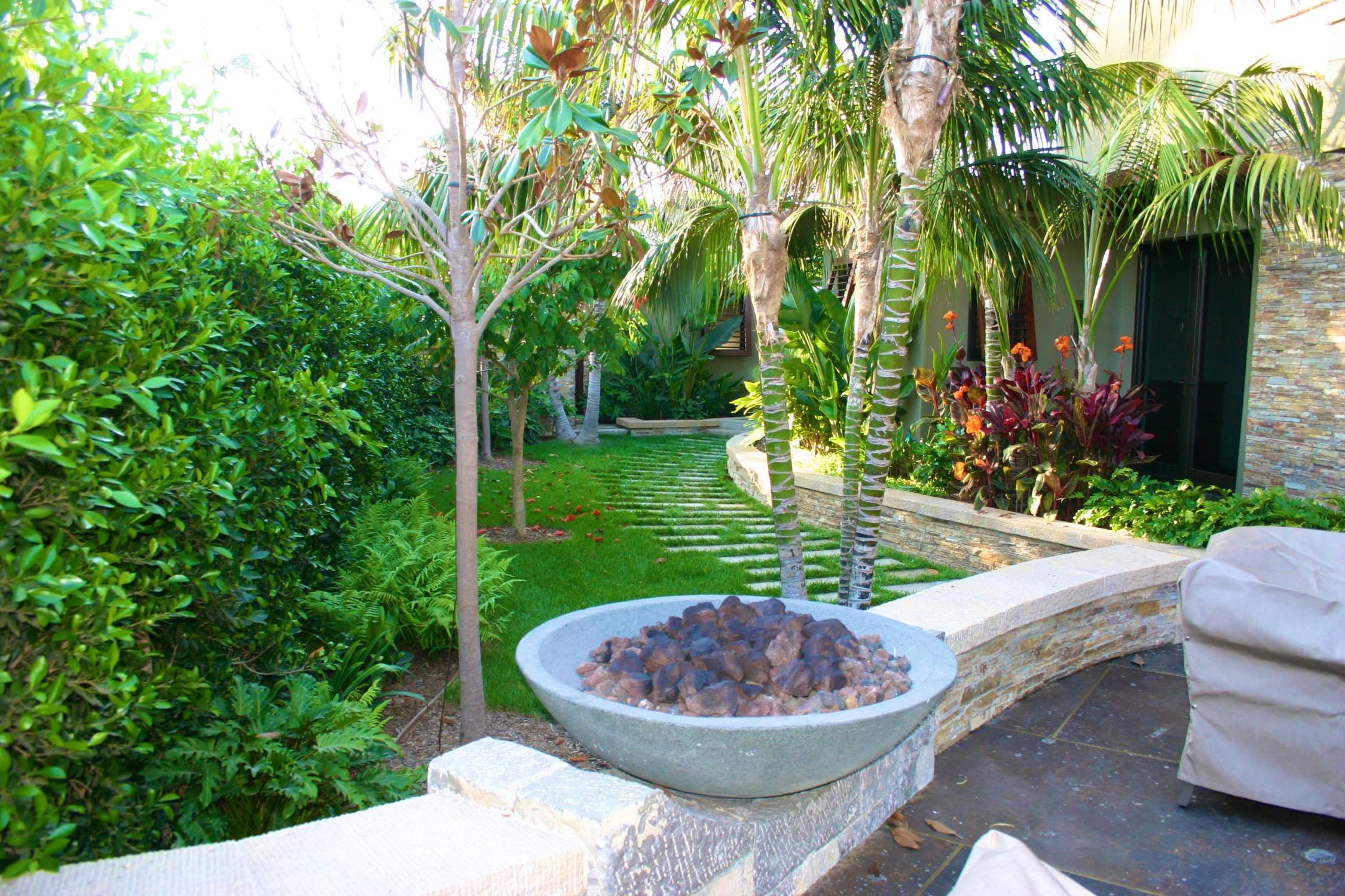  Side garden with stone walkway and fire bowl 