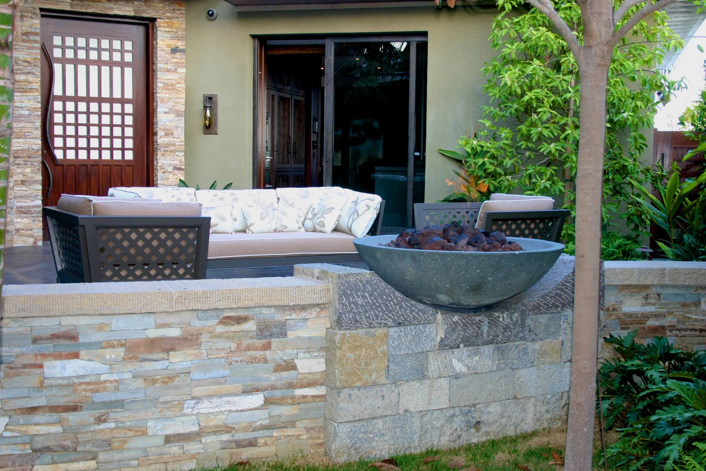  Back patio with custom design wood doors and fire bowl 
