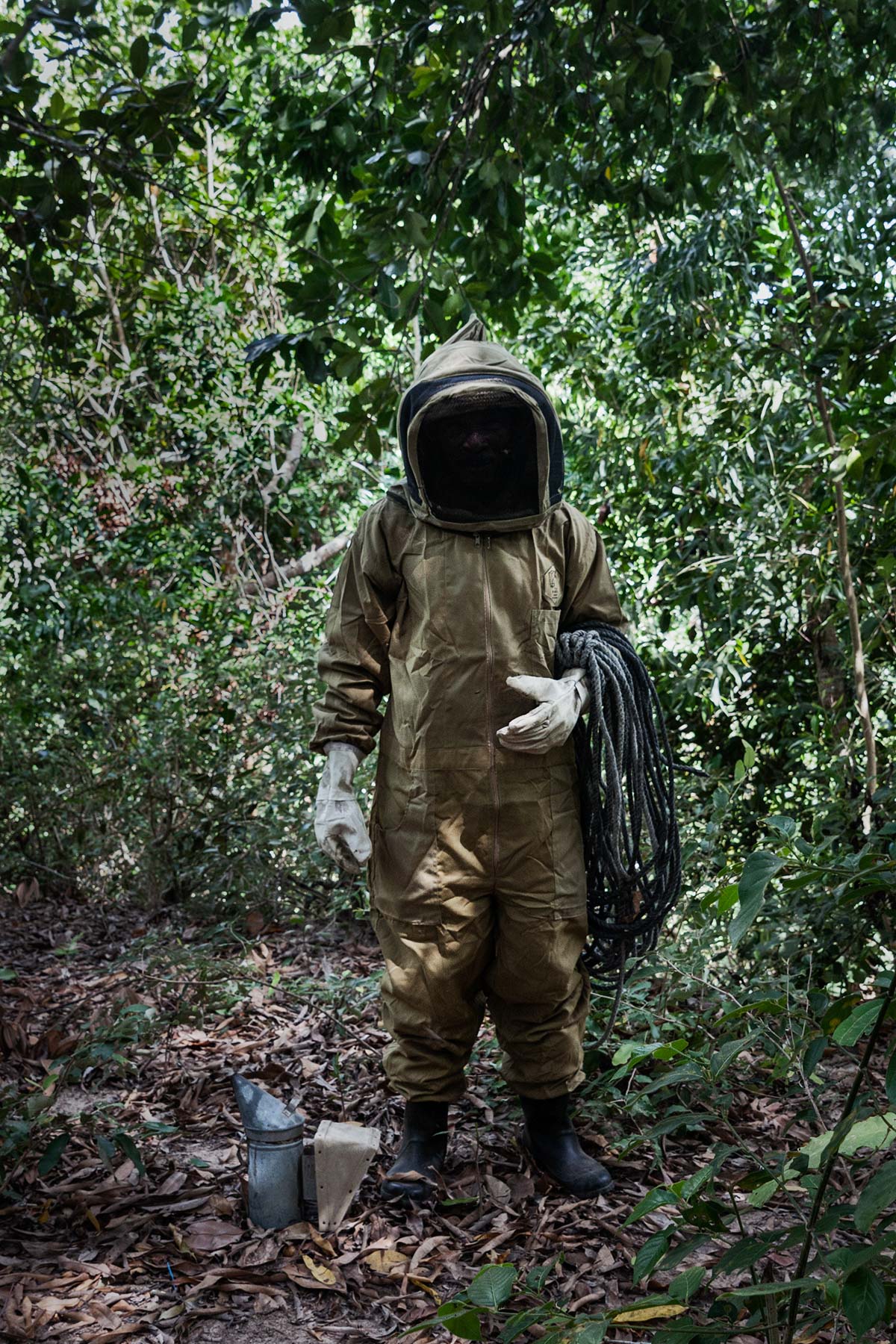 Mohamed stands in the jungle.