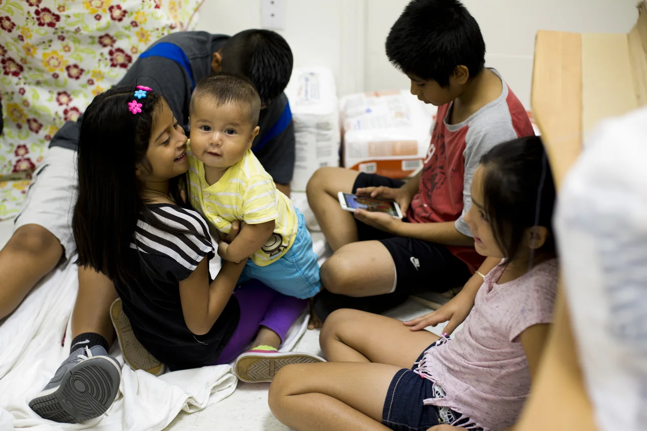  A group of children hangout while their mothers learn sewing skills during a class in Immokalee on July 6, 2016. Handmade Immokalee is a weekly class devoted to helping local women develop sewing skills.&nbsp; 