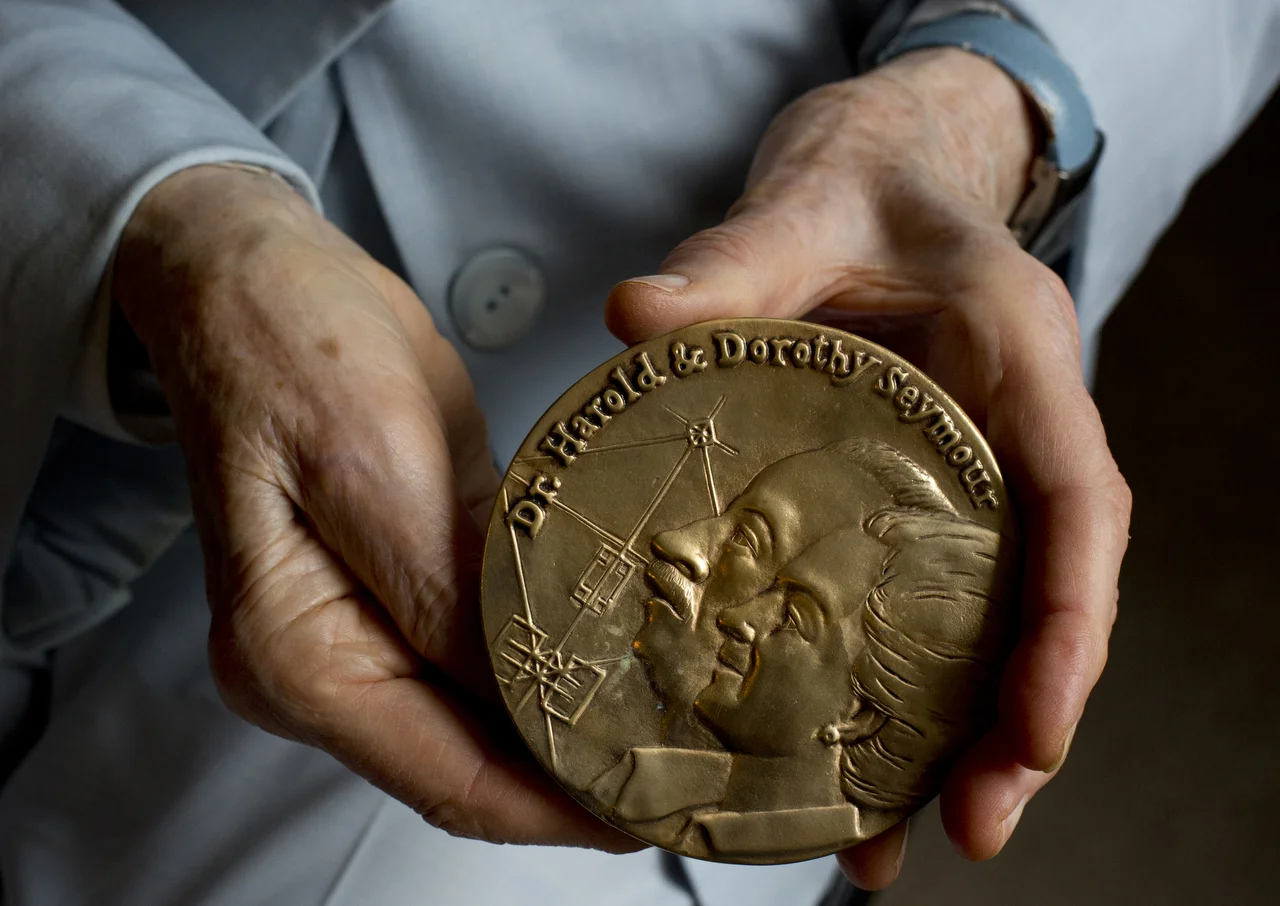  Dorothy Mills holds her Seymour Medal award on July 8, 2016 at The Carlisle Naples. The award is given out every year to the best book of baseball history or biography published during the preceding year.&nbsp; 