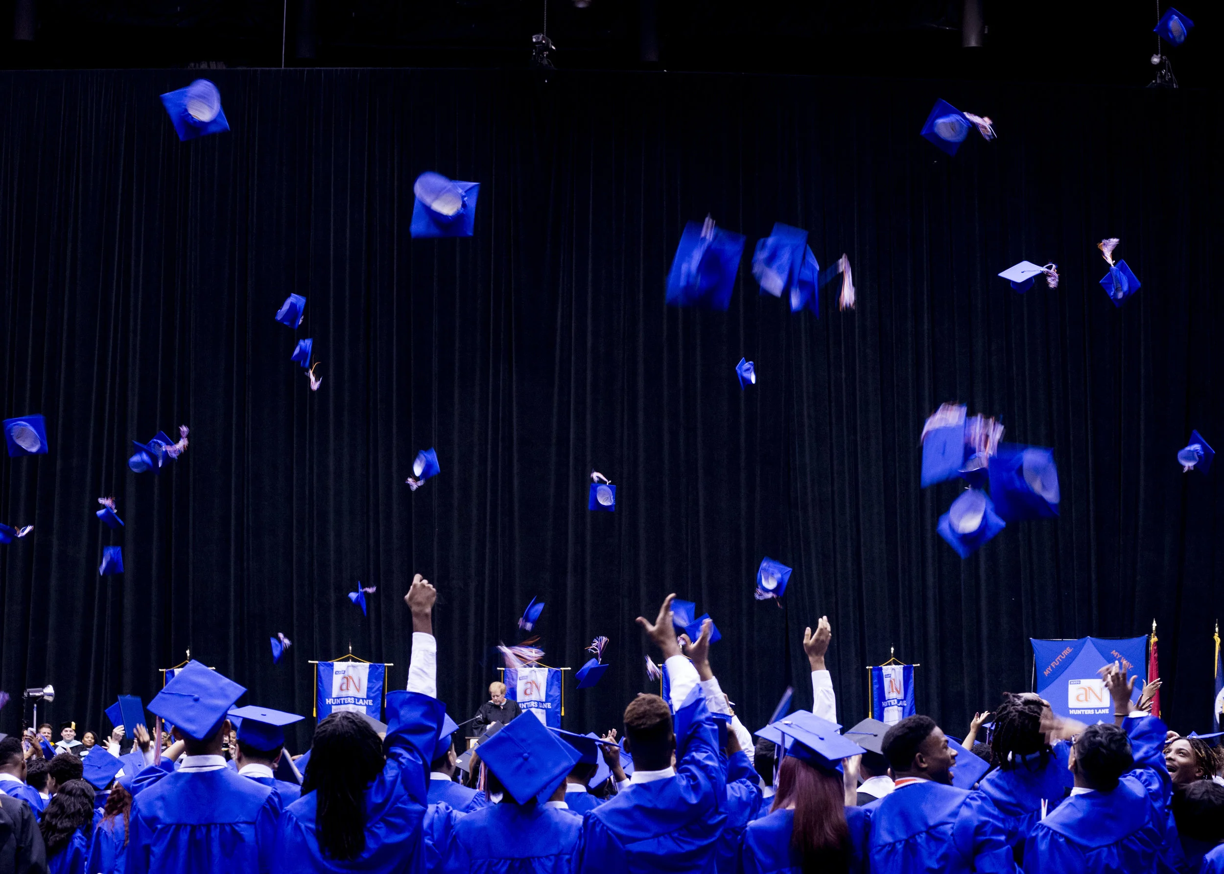  Hunters Lane 2017 graduates toss their caps at the conclusion of their ceremony on May 13, 2017. 