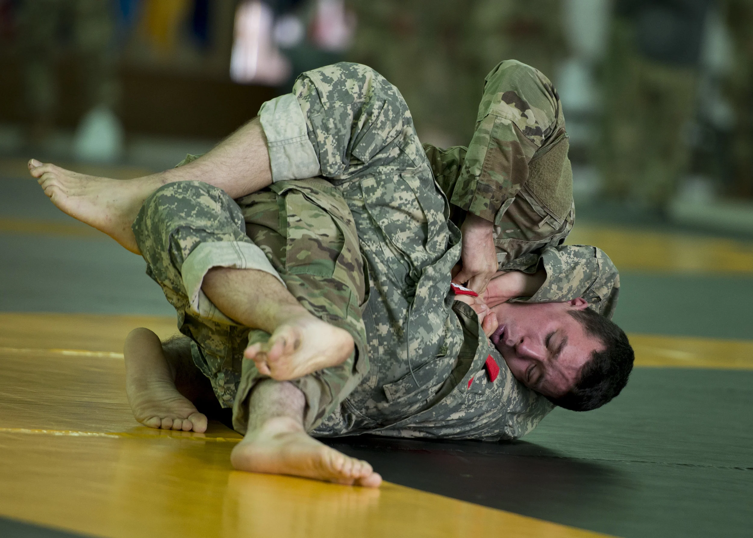  Two soldiers face off in a match during the Combatives Tournament at Fort Campbell during Week of the Eagles on May 22, 2017. 