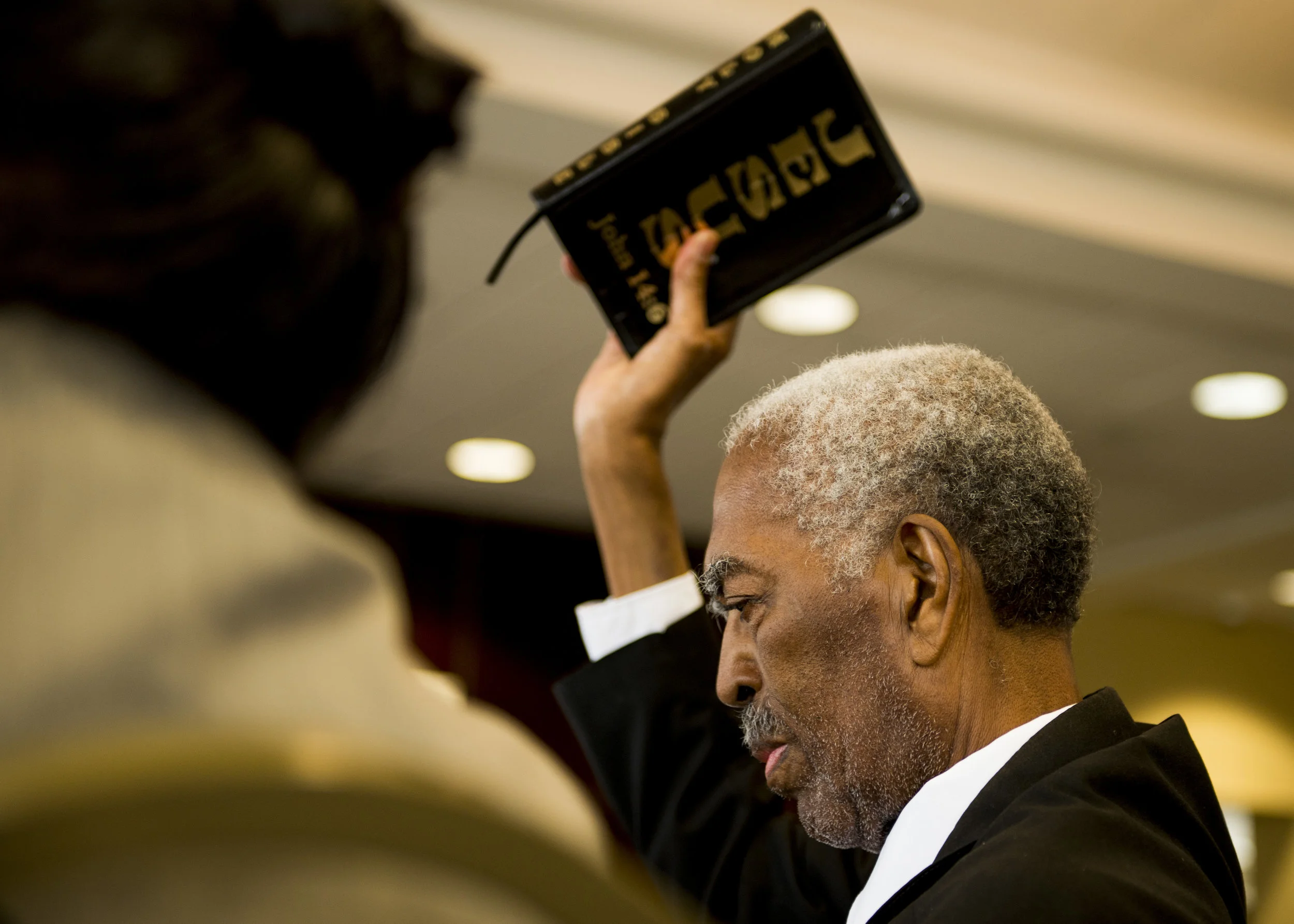  Pastor Jimmy Terry holds his bible in the air while asking for an "Amen" from friends and family at his luncheon on June 12, 2017. Terry passed away one week later from cancer.&nbsp; 