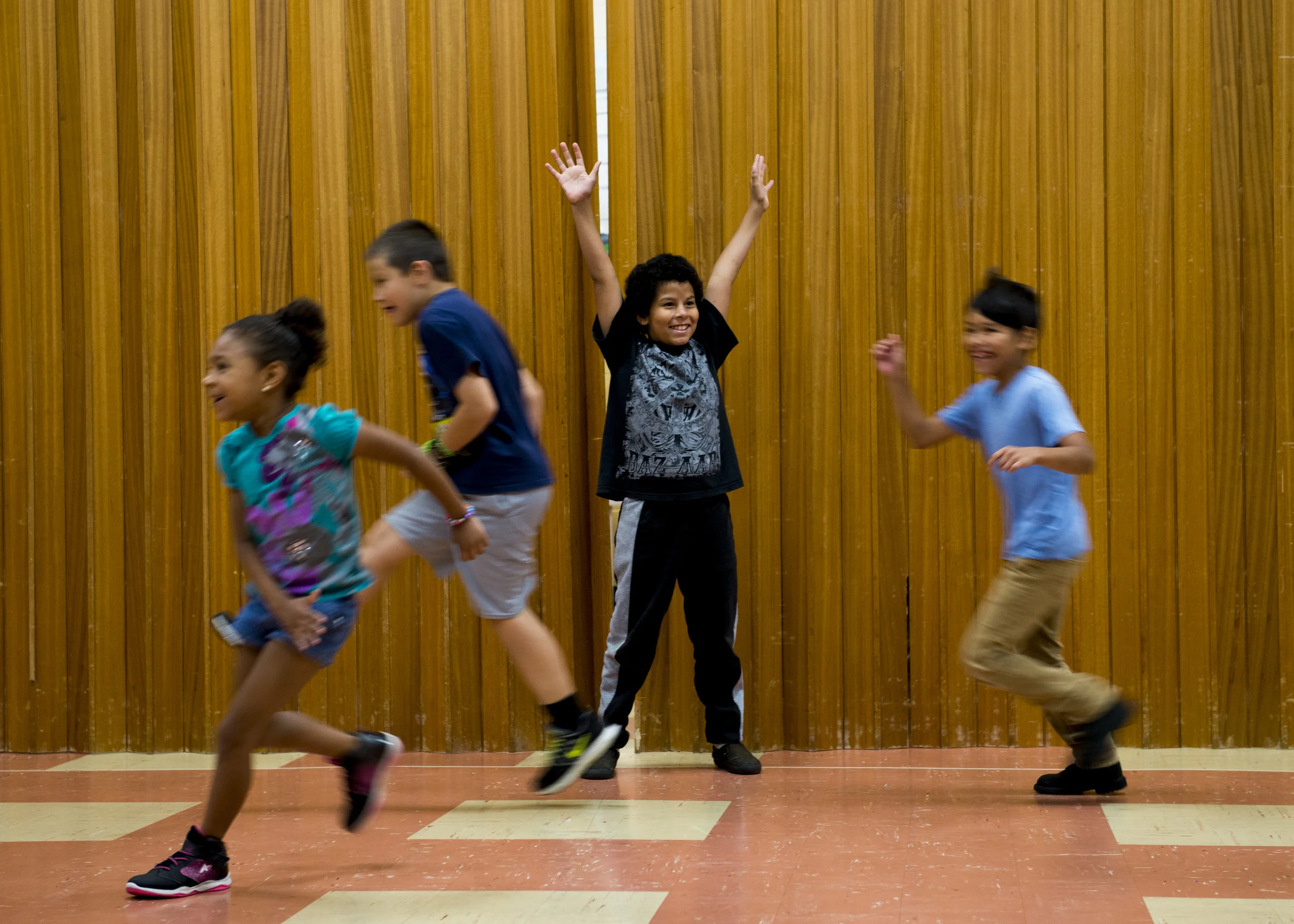  Kids play freeze-tag during Project Transformation's summer camp at New Providence Baptist Church in Clarksville. 