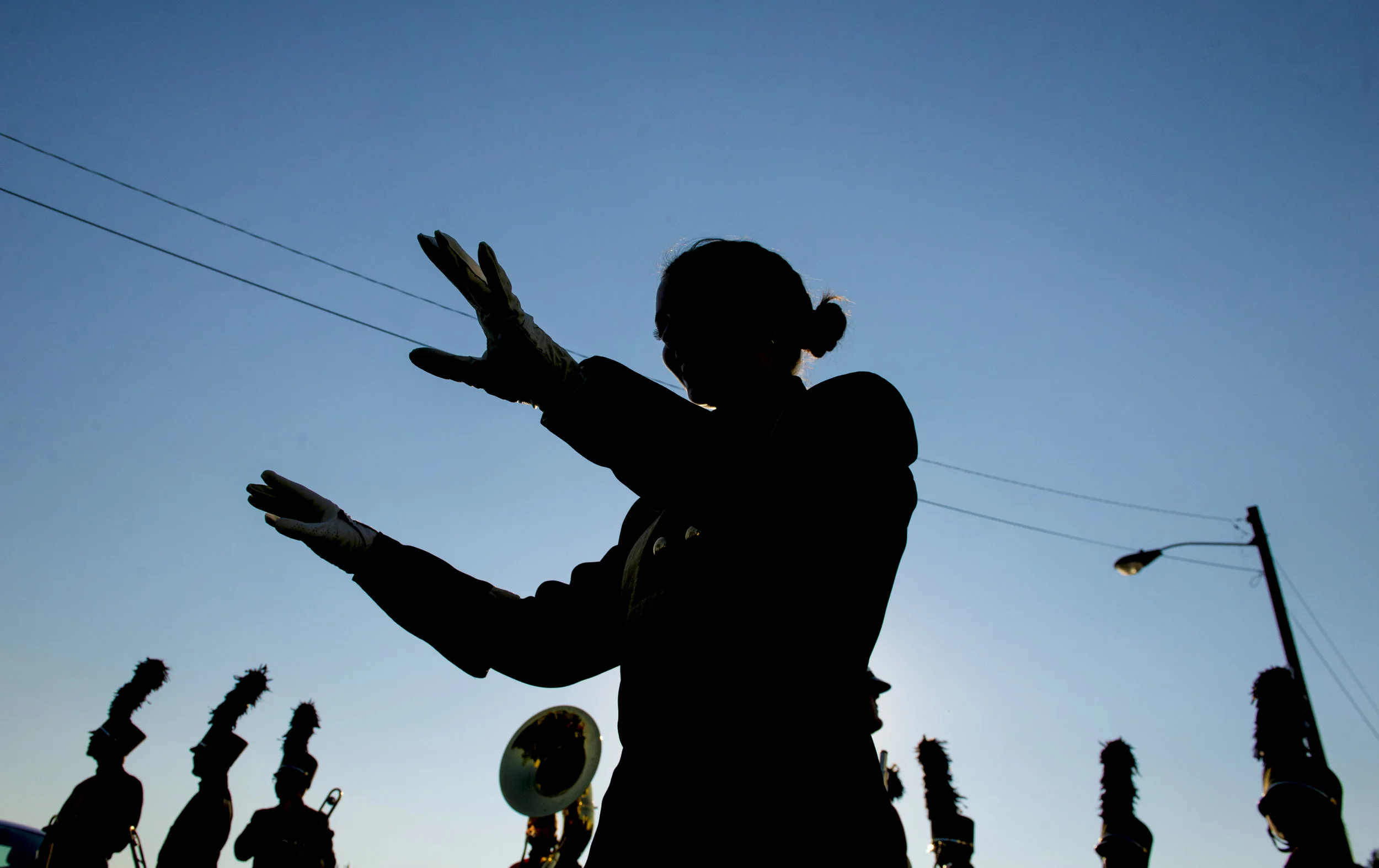  Kathryn Boyer, a drum major for Rossview, practices her directing during pregame for Clarksville and Rossview's football game on August 18, 2017. 