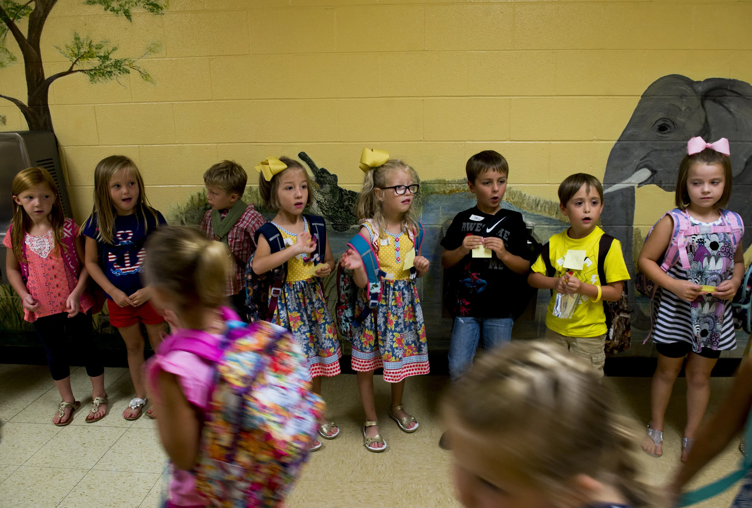  Montgomery Central Elementary students line up through the halls as they wait for their parents to pick them up after their first day of school on August 7, 2017. 