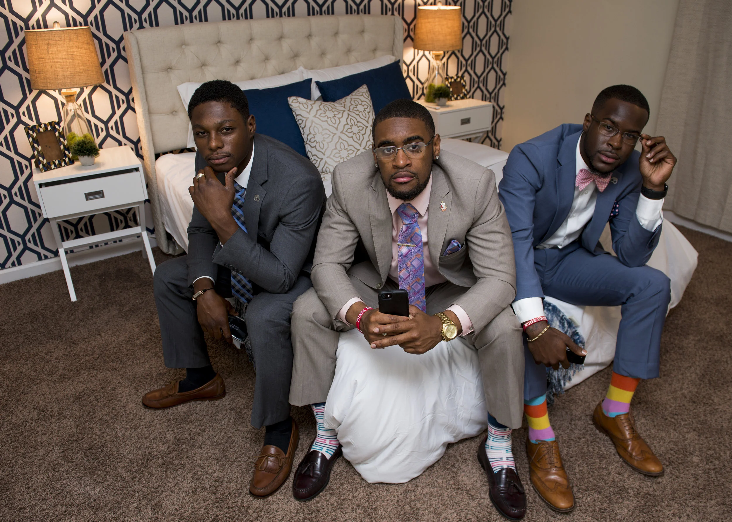  From left, President JaQuar McMickle, CEO Guy Stanford Jr., and Director of Marketing Zavion Williams, all pose for a portrait in their demo room for Infinity Co. 
