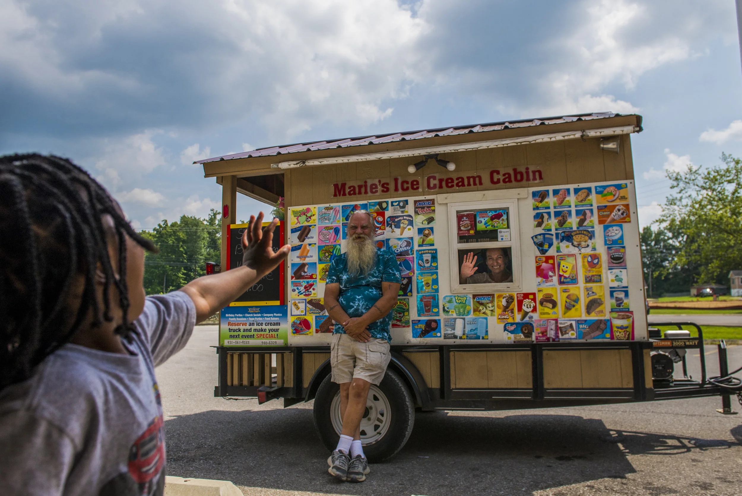  Zamari Cross, 2, waves to Gary and Marie Caudell, owners of Marie's Ice Cream Cabin. The couple visits Kids Depot every Thursday. 
