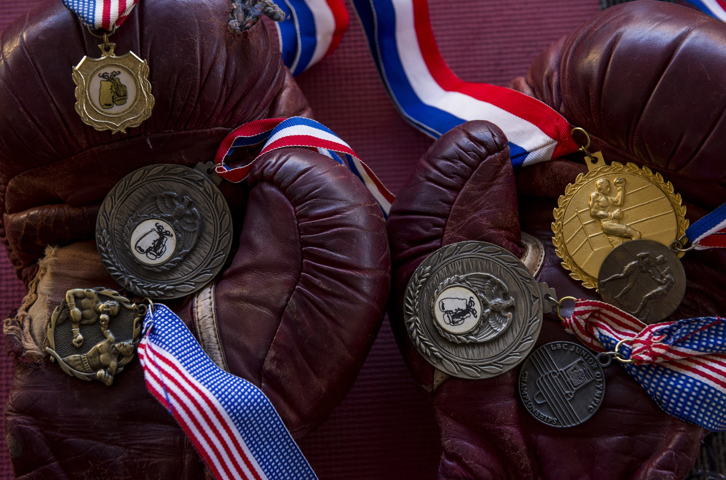  An old pair of boxing gloves holds the 7 medals found inside a folded American flag in an empty home in Paris, Tennessee.  https://usat.ly/2AD2BHG 