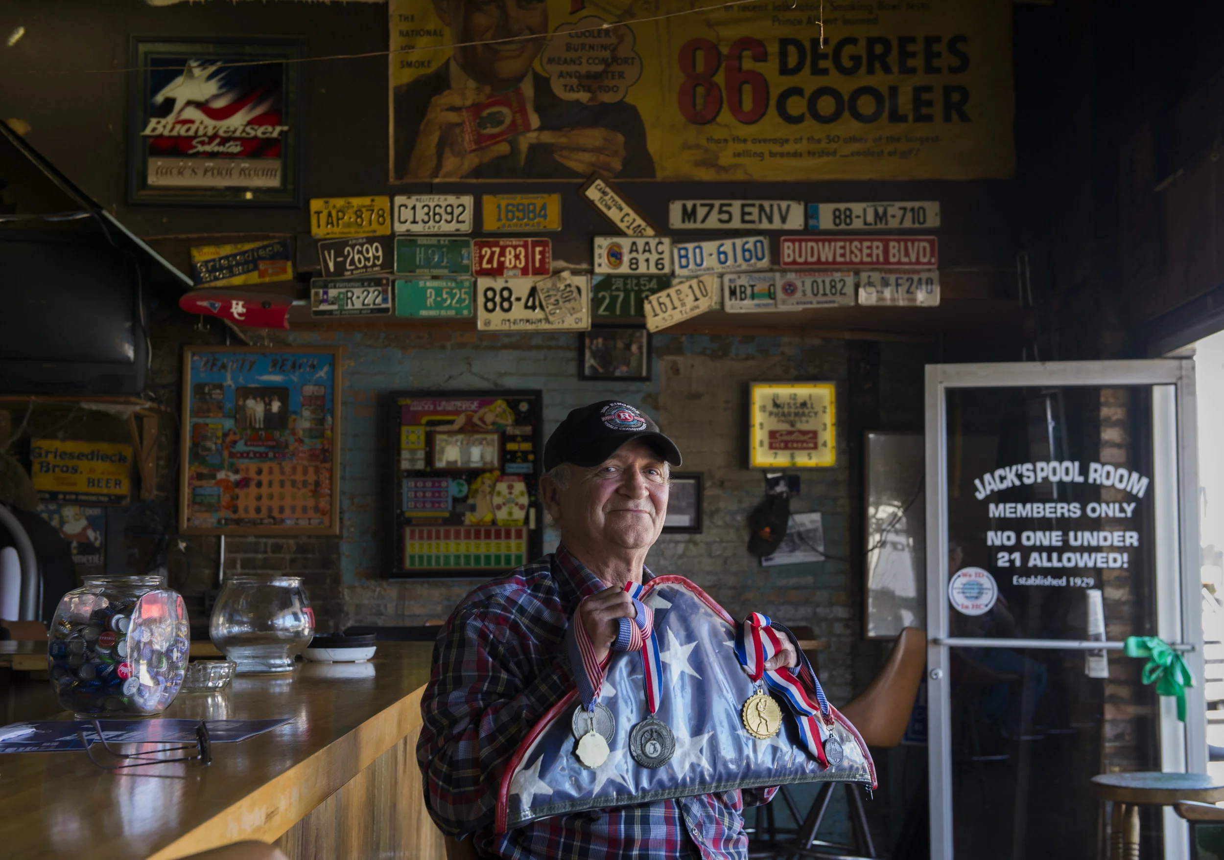  Neely Owens holds the folded American flag and all the boxing medals found inside at Jack's Pool Room in Paris, Tennessee on October 26, 2017. After painters found the flag and medal in an empty home over a year ago, Owens has been trying to find th