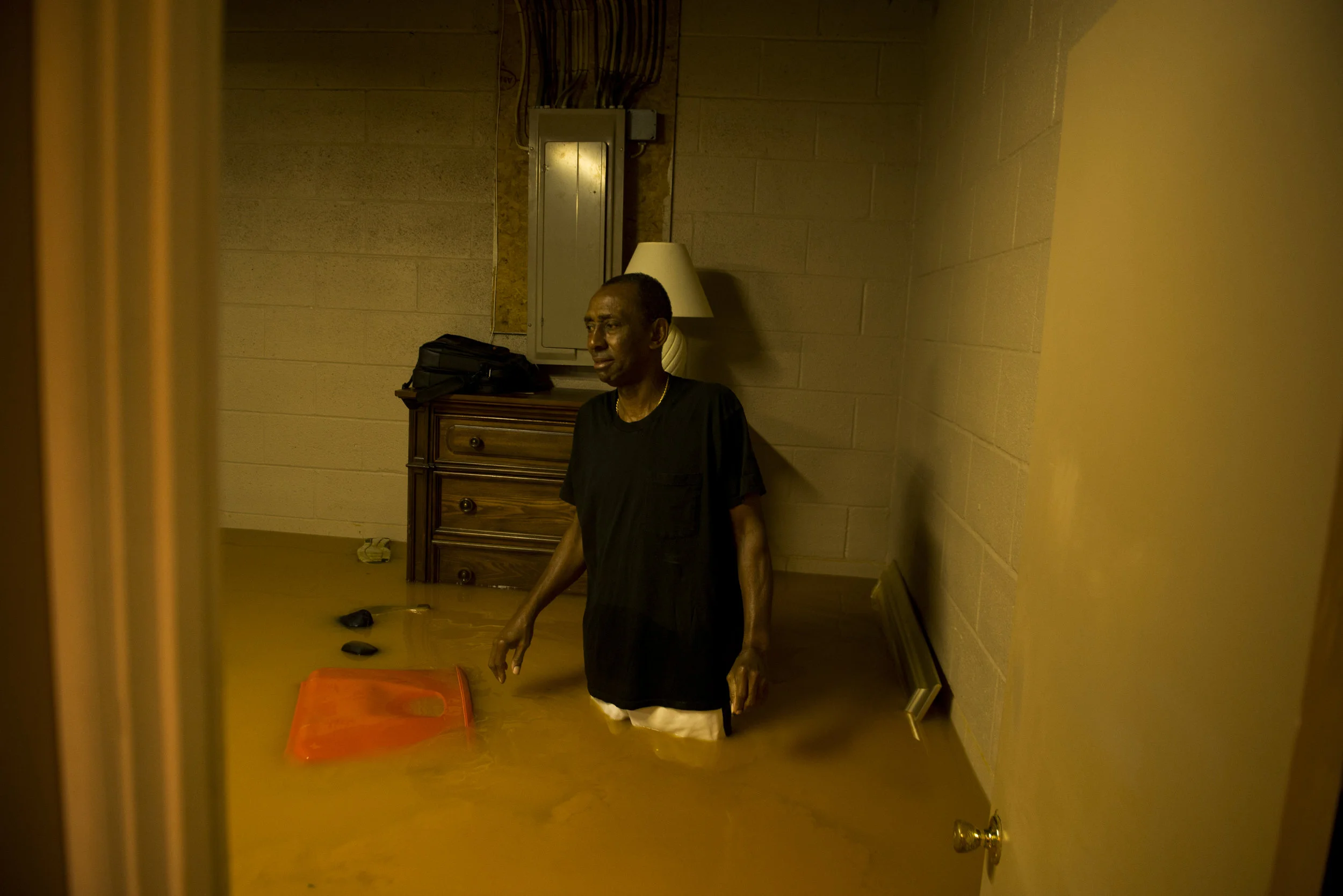  Willie Dunlap looks at his flooded basement from his home on Powell Drive in Clarksville on September 1, 2017 
