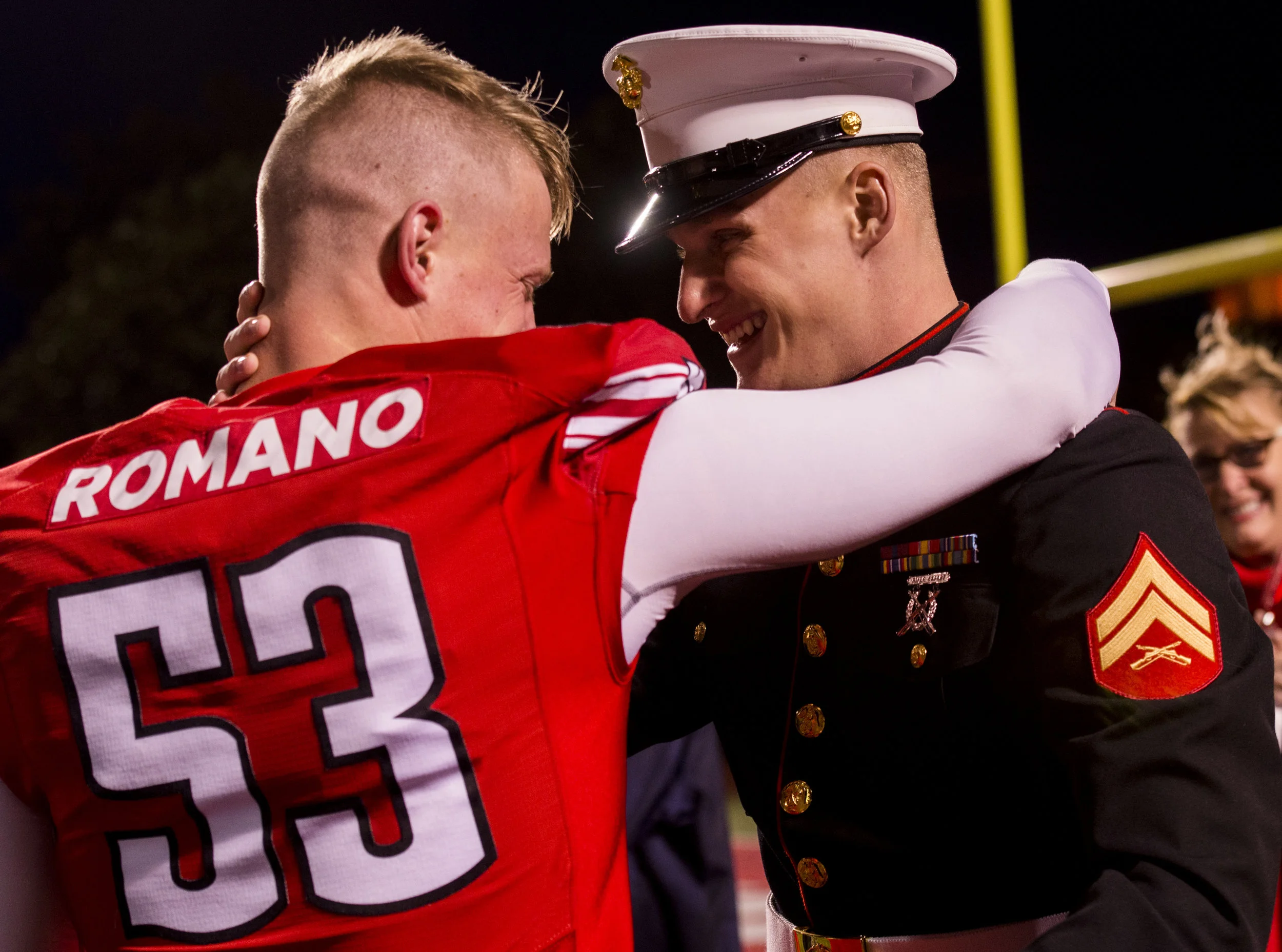  Senior Kyle Romano, 53, hugs his brother Chad Romano, who surprised him to watch the game against Eastern Illinois on November 18, 2017. It was the first, and last game his brother would see him play in his college career. 