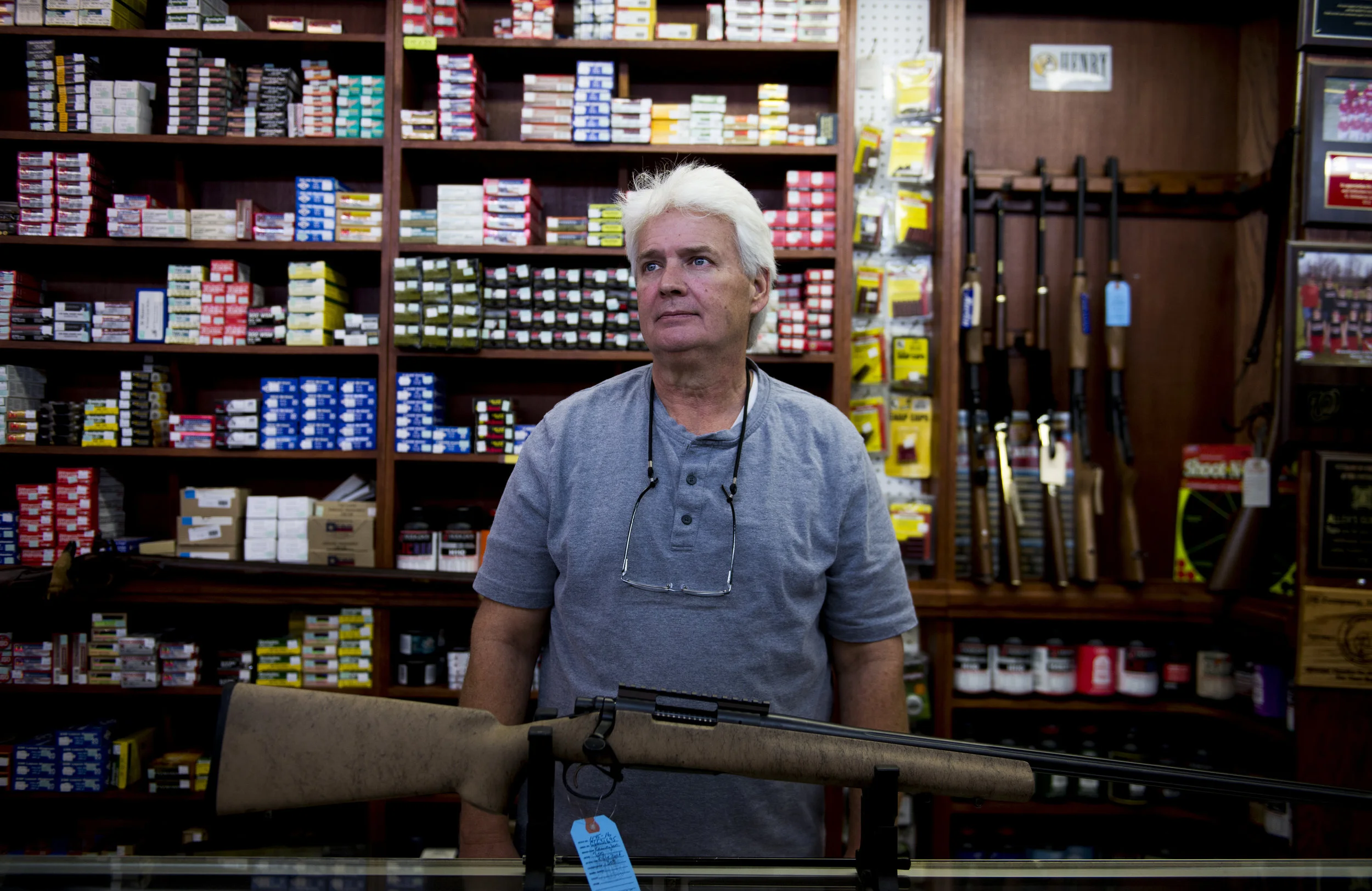  Randy Maney of Allen’s Gun Shop stands in their storefront in the aftermath of the shooting in Las Vegas, which has heightened the debate over gun rights. 