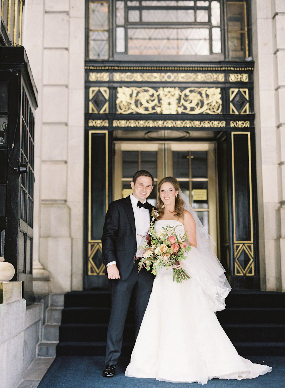 Bride and groom outside the Plaza Hotel