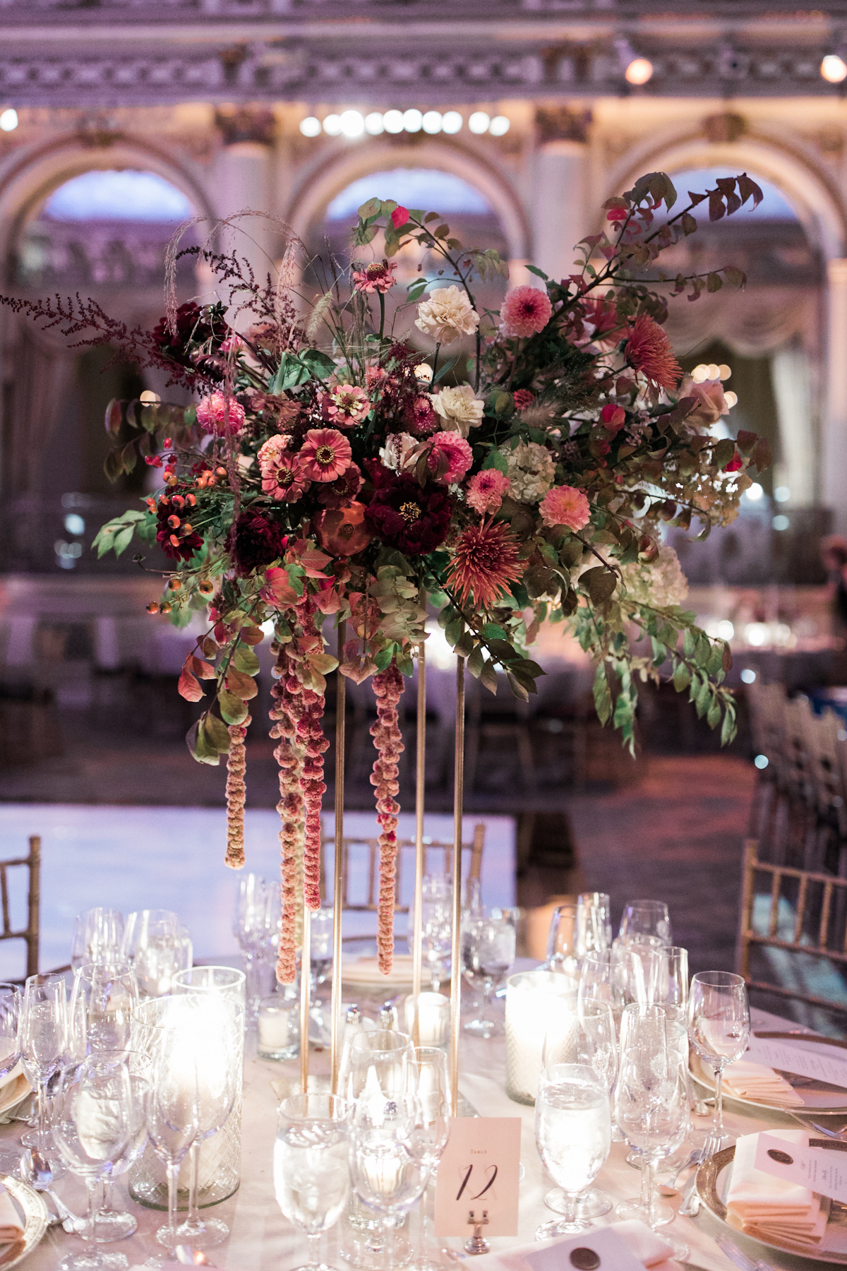 Plaza wedding tall floral centerpieces and candles