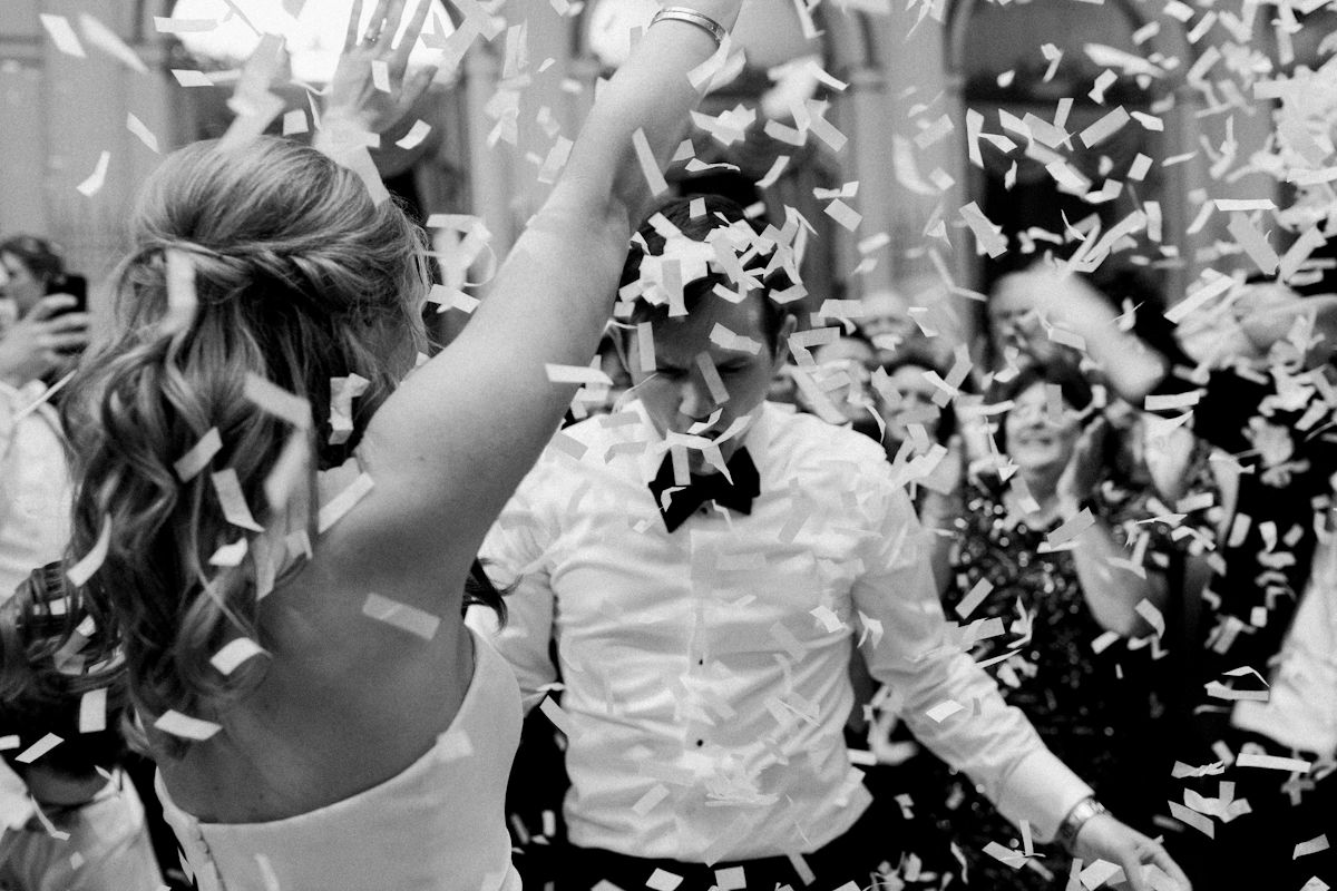 Bride and groom dancing in confetti at Plaza wedding