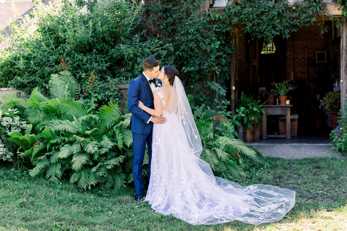 Bride and groom kiss at Blue Hill a Stone Barns wedding