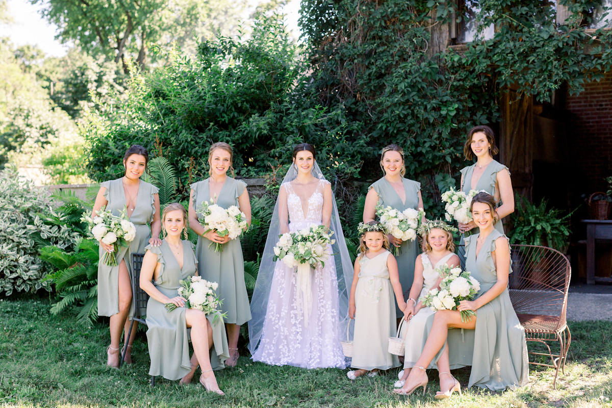 Bride, bridesmaids in sage green and flower girls at Blue Hill at Stone Barns wedding