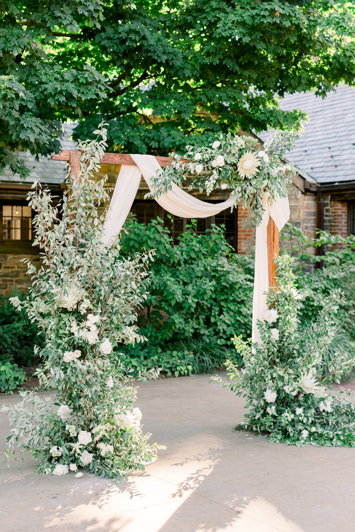 Floral arch with protea at Blue Hill at Stone Barns wedding