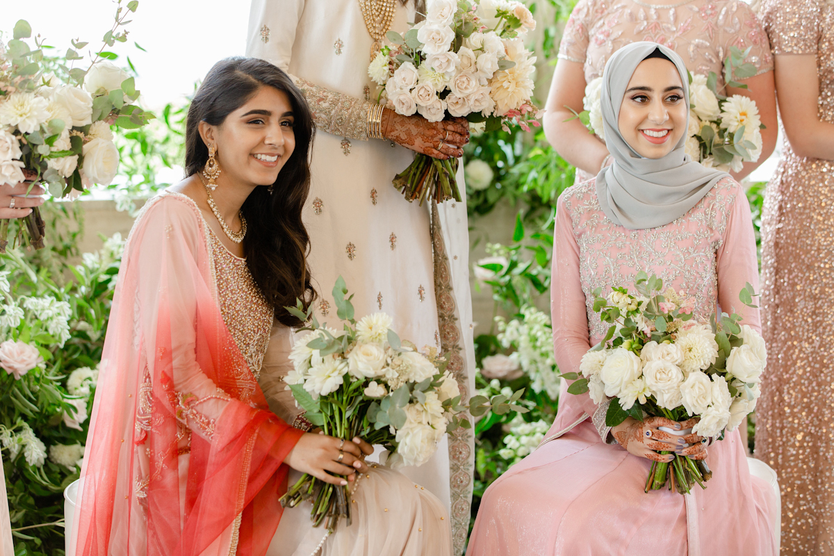 South asian bridesmaids at Rainbow Room wedding holding bouquets
