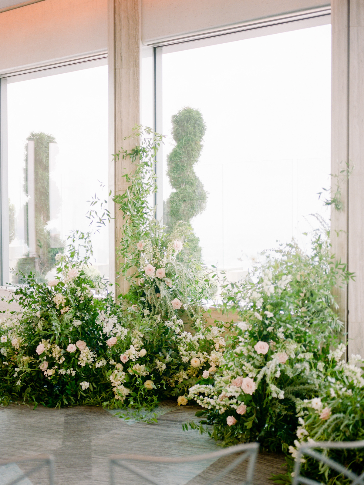 Rainbow Room wedding ceremony with flowers growing up from the ground