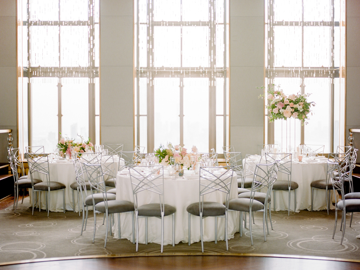 Rainbow Room wedding flowers with tall and low lush centerpieces