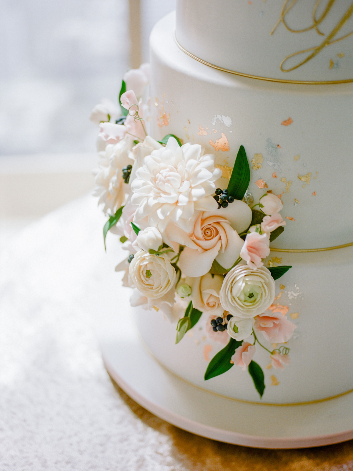 Sugar flowers on fondant cake at Rainbow Room wedding