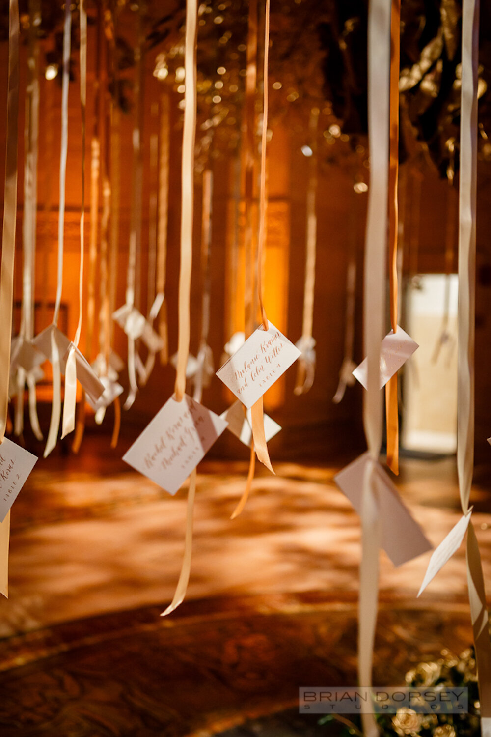 Cipriani wedding hanging escort cards with hand calligraphy