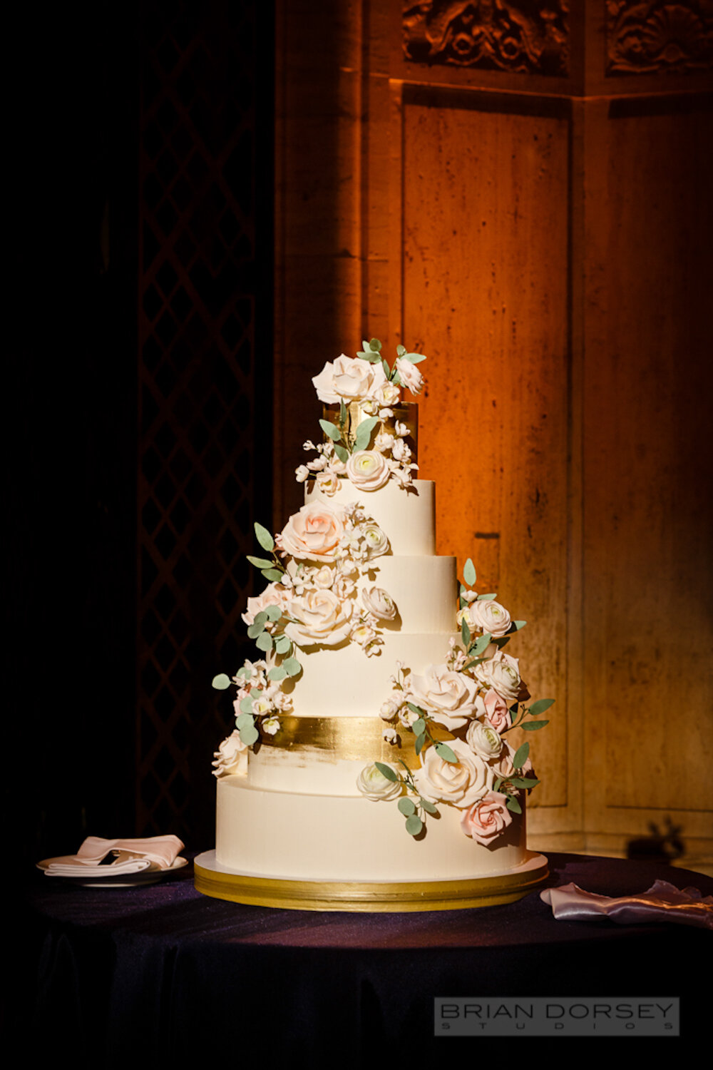 Cipriani 25 Broadway Wedding cake with sugar flowers and metallic gold finish