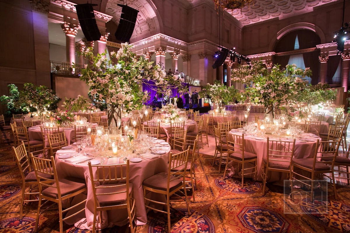 Cipriani Wall Street Wedding tall branch arrangements