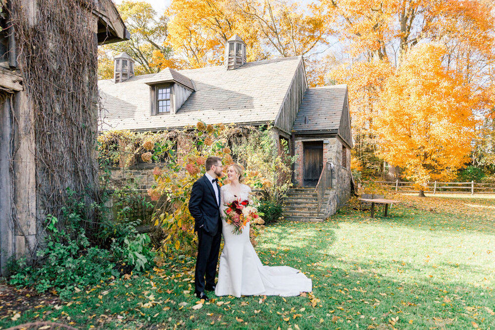 Blue Hill at Stone Barns Wedding bride and groom in front of barn
