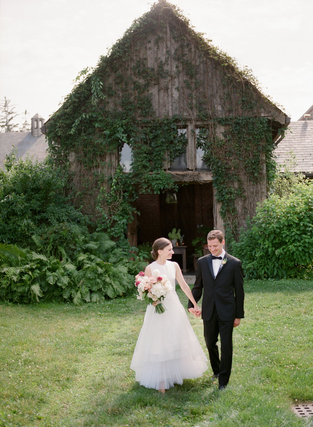 Blue Hill at Stone Barns wedding bride groom in front of ivy covered shed