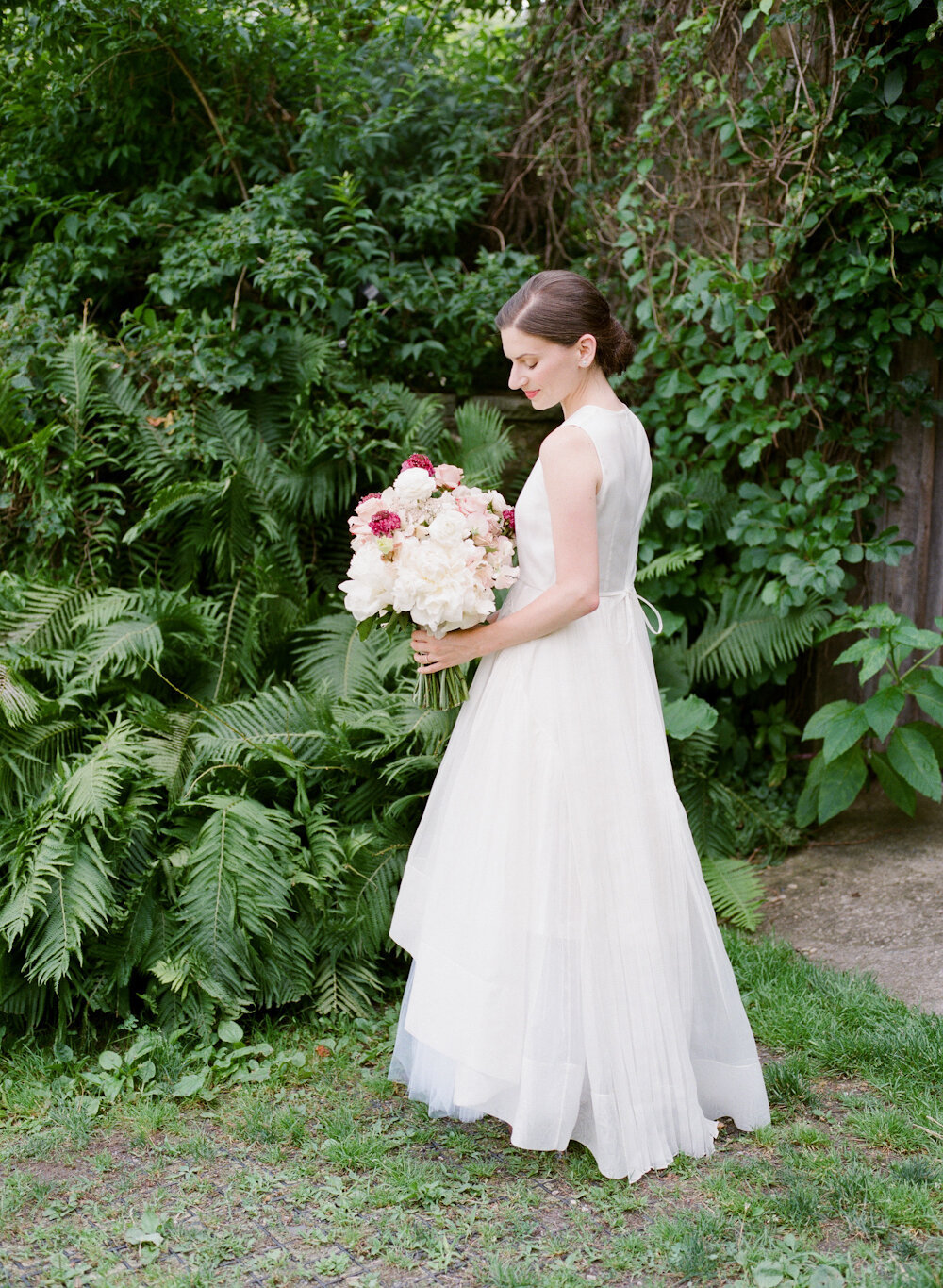 Blue Hill at Stone Barns wedding bride holding flowers in Morgan le Fay